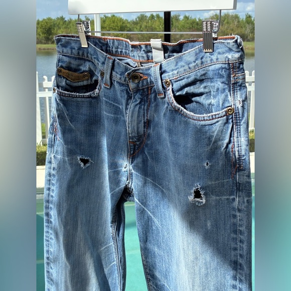 Low Rise Distressed Jeans - Picture 2 of 10